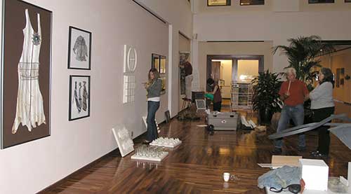 Hanging the Front Lobby, Alison on the left, Lorraine's husband and Catherine Evans on the right
